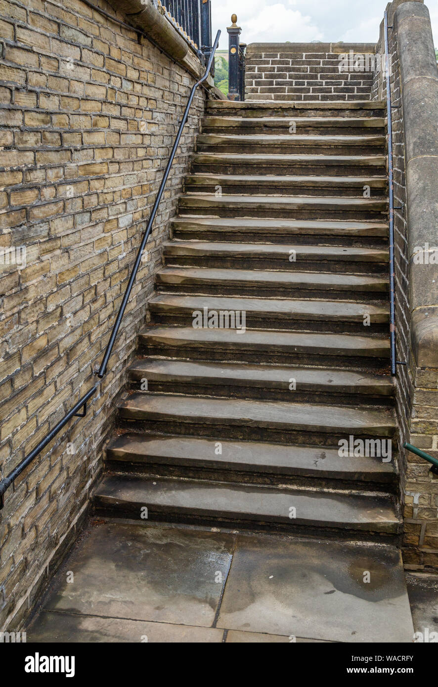 Millworkers steps outside Salts Mill in Saltaire, Yorkshire.The steps lead from the outside of the mill up to the pavement. Stock Photo