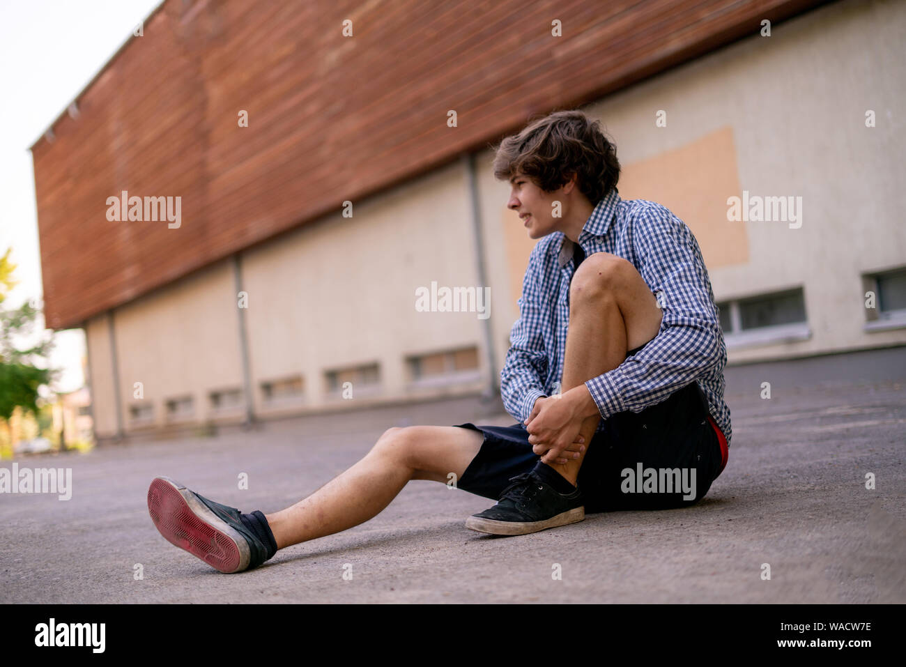 man on the ground, got injury outdoors, fall down Stock Photo