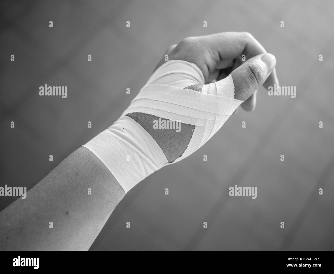 Black and white version of Thumb tape job for a thumb sprain Stock Photo