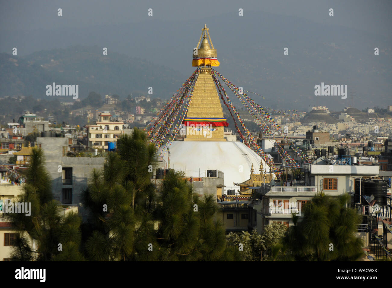 Boudhanath Tibetan Buddhist stupa with colorful prayer flags flying, Kathmandu, Nepal Stock Photo