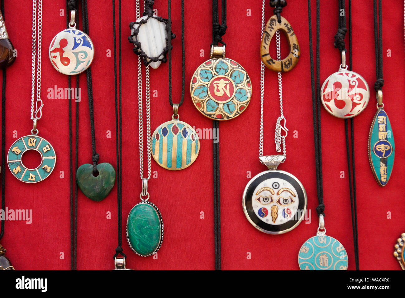 Medallion necklaces displayed for sale at shop in Thamel district of Kathmandu, Nepal Stock Photo