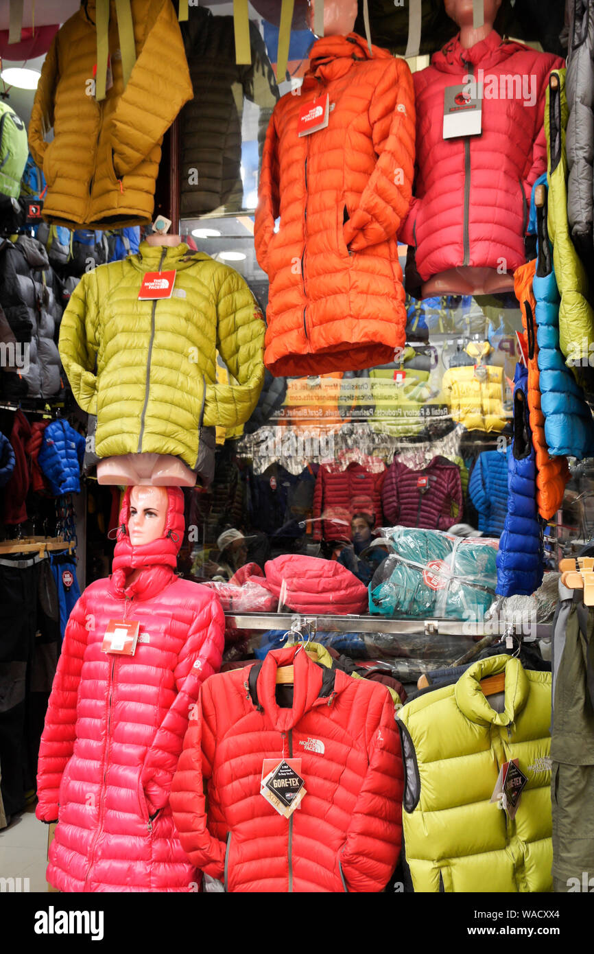 Colorful North Face quilted jackets displayed in store window in Thamel  district of Kathmandu, Nepal Stock Photo - Alamy