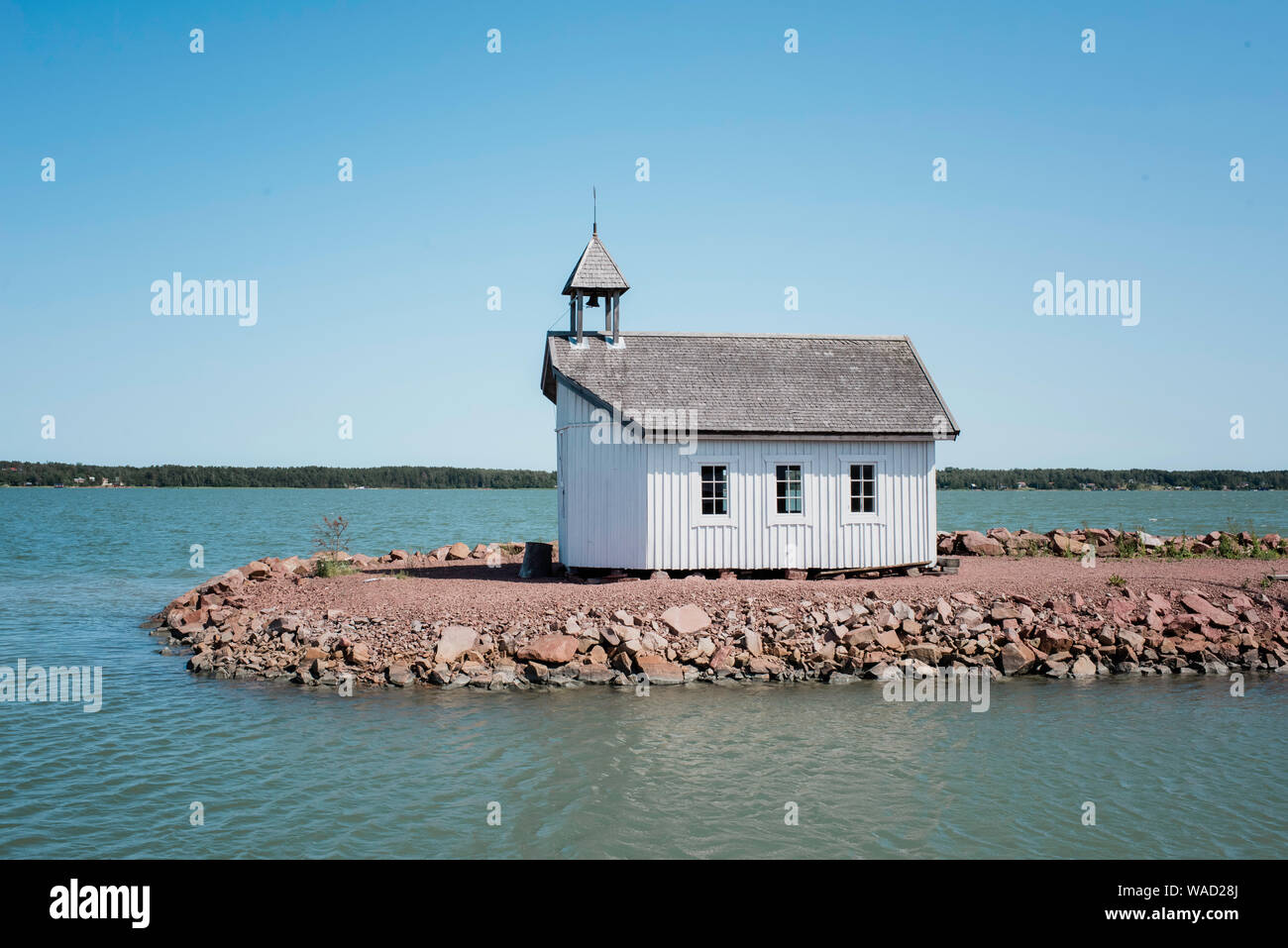 traditional Scandinavian house on the end of pier at sea in summer Stock Photo