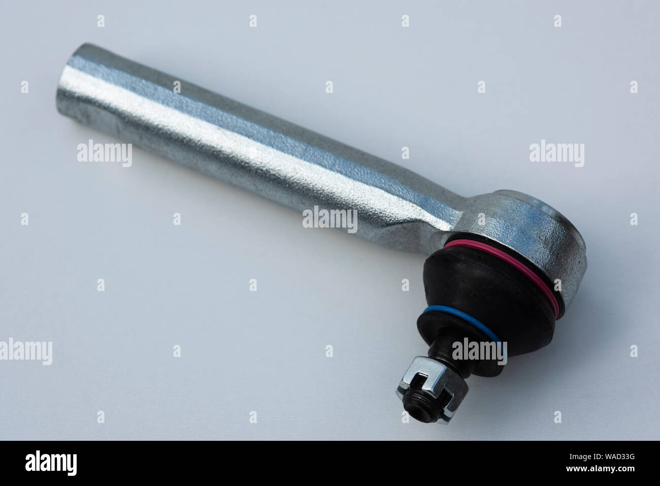 A new tie rod end showiing rubber gaiter and castellated nut prior to installation on a modern passenger vehicle Stock Photo