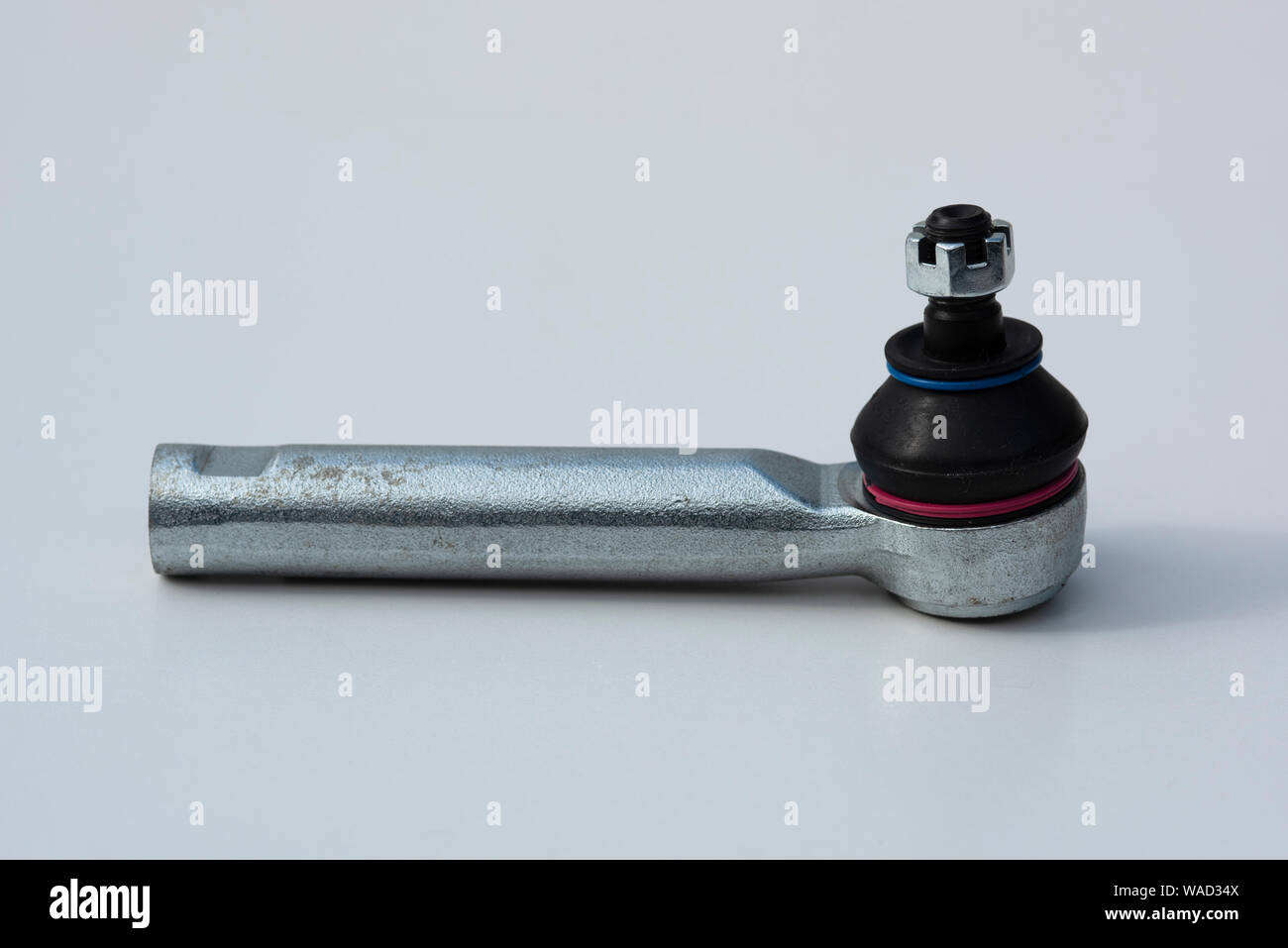 A new tie rod end showiing rubber gaiter and castellated nut prior to installation on a modern
