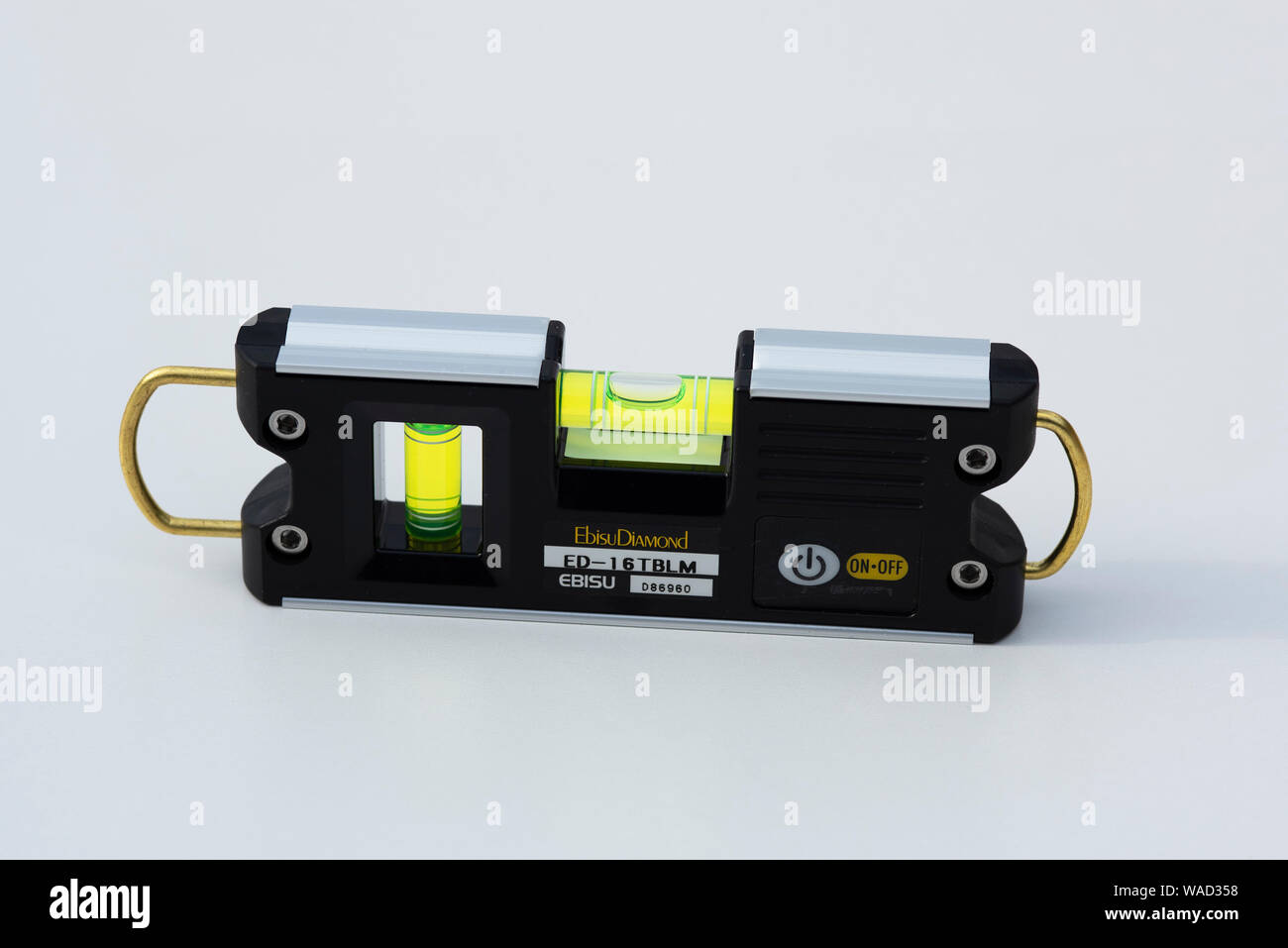 A dual axis spirit level with illuminated windows for use in low light Stock Photo