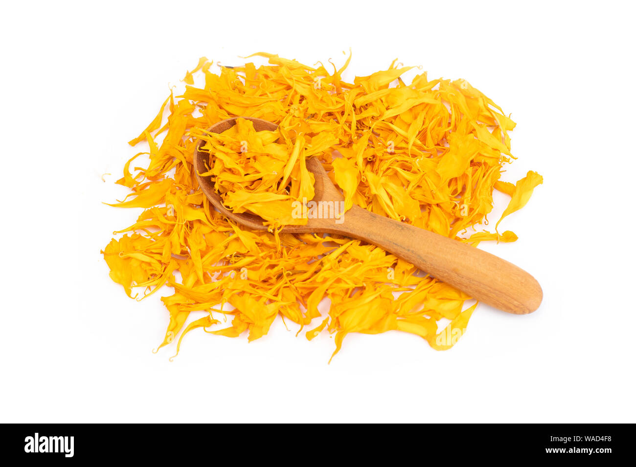 herbal calendula  in wooden sppon isolated on white background Stock Photo