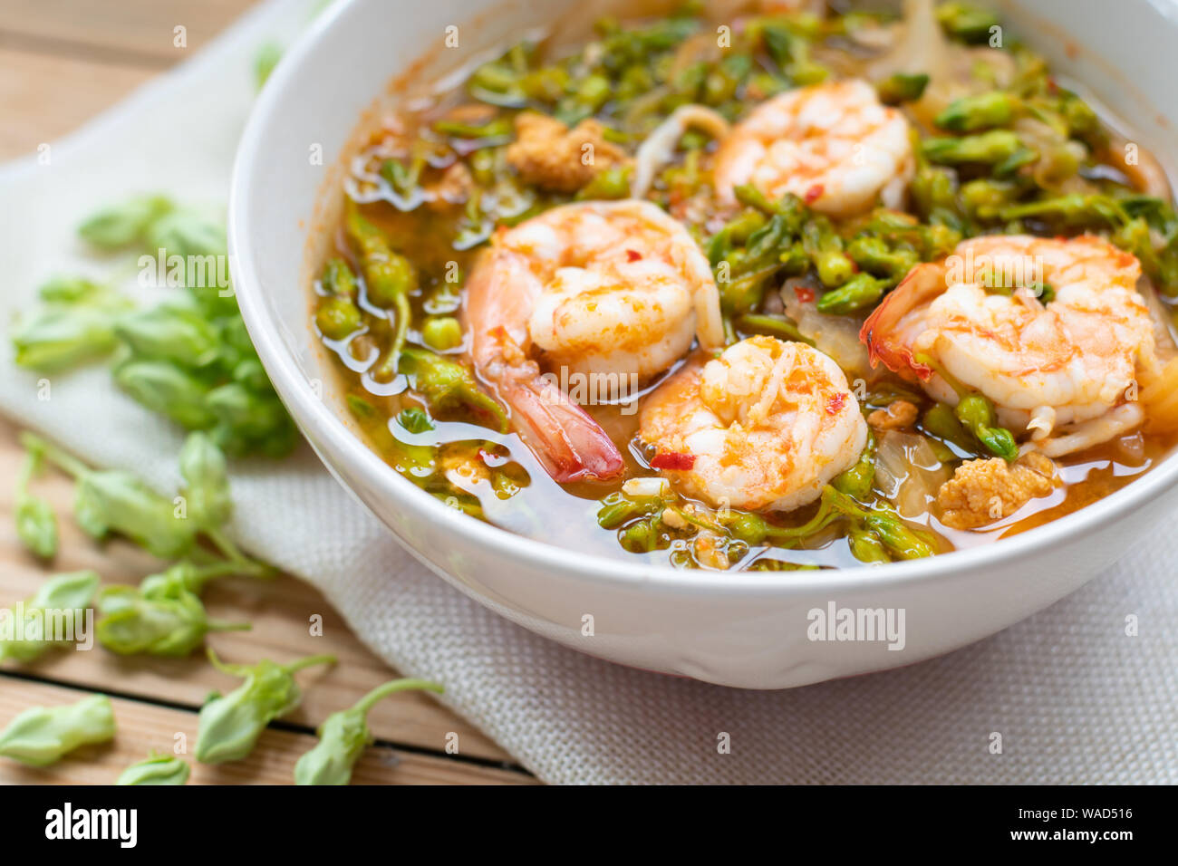Sour soup with shrimp and cowslip creeper Stock Photo