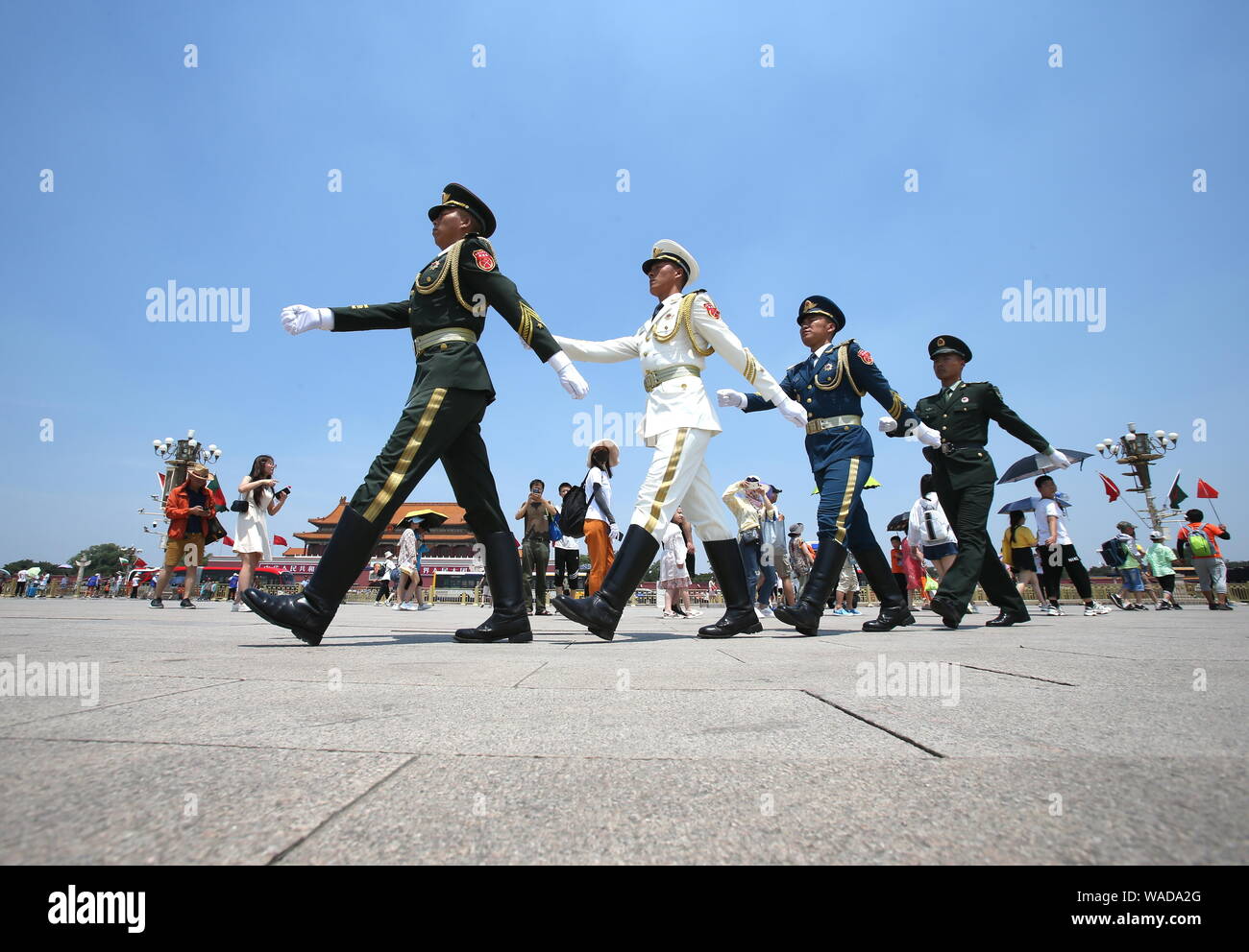 Chinese paramilitary policemen patrol the Tian'anmen Square on a scorching day in Beijing, China, 4 July 2019. Stock Photo