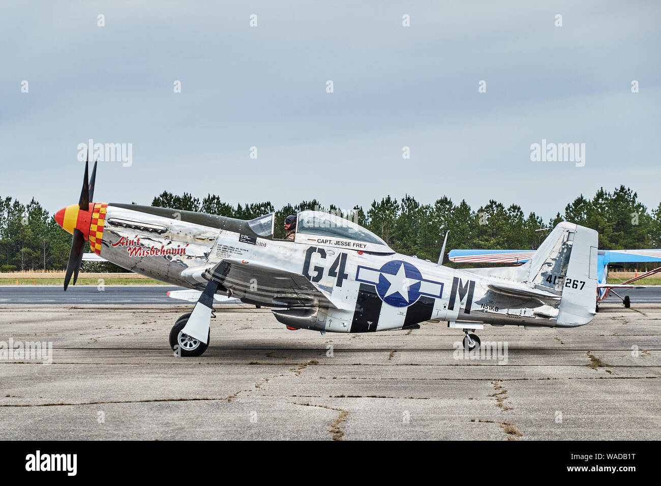 Parked vintage American P 51 Mustang fighter airplane, the Ain't Misbehaven, from WWII era in Bessemer Alabama, USA. Stock Photo