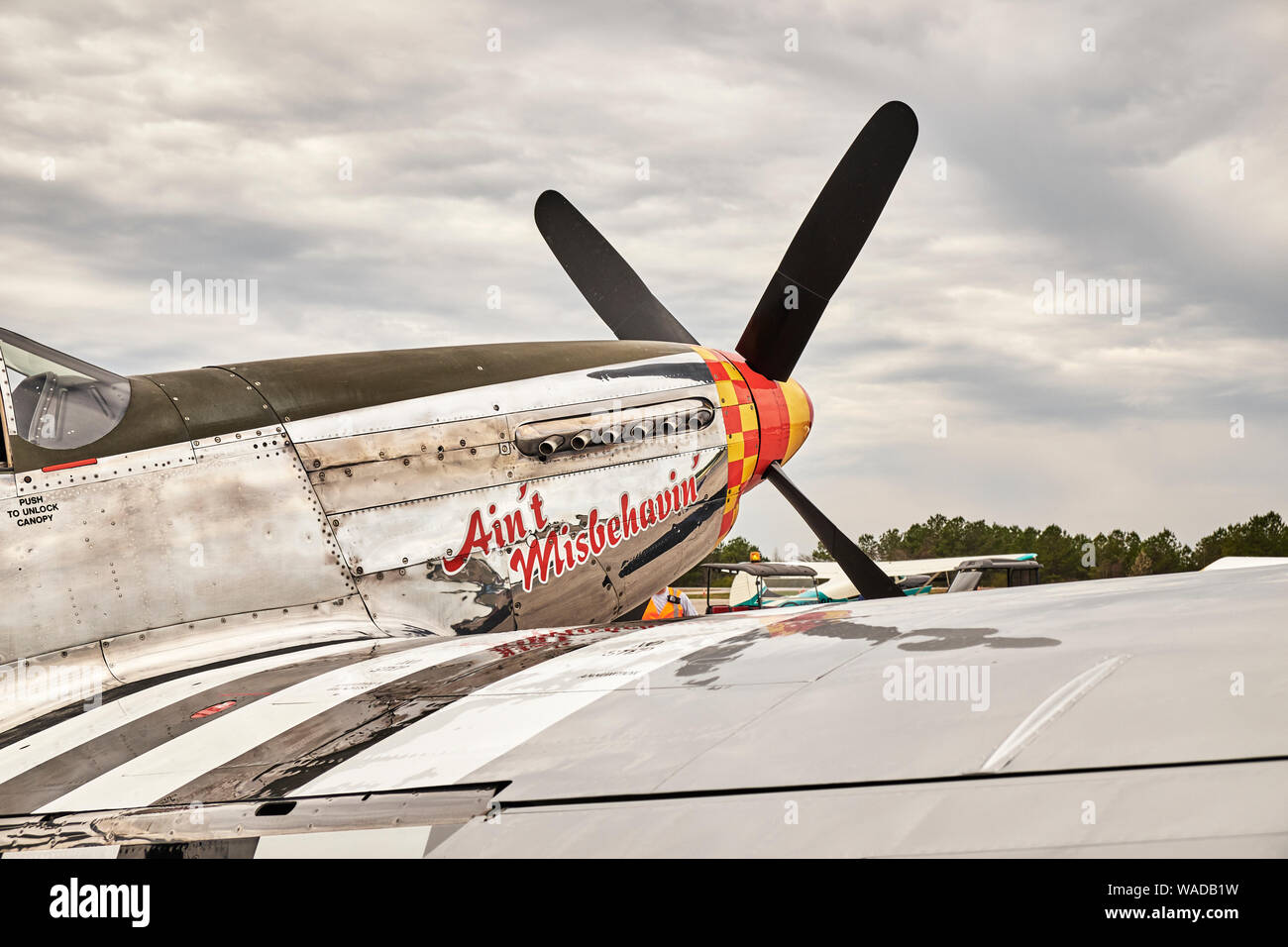 Parked vintage American P 51 Mustang fighter airplane, the Ain't Misbehaven, from WWII era in Bessemer Alabama, USA. Stock Photo