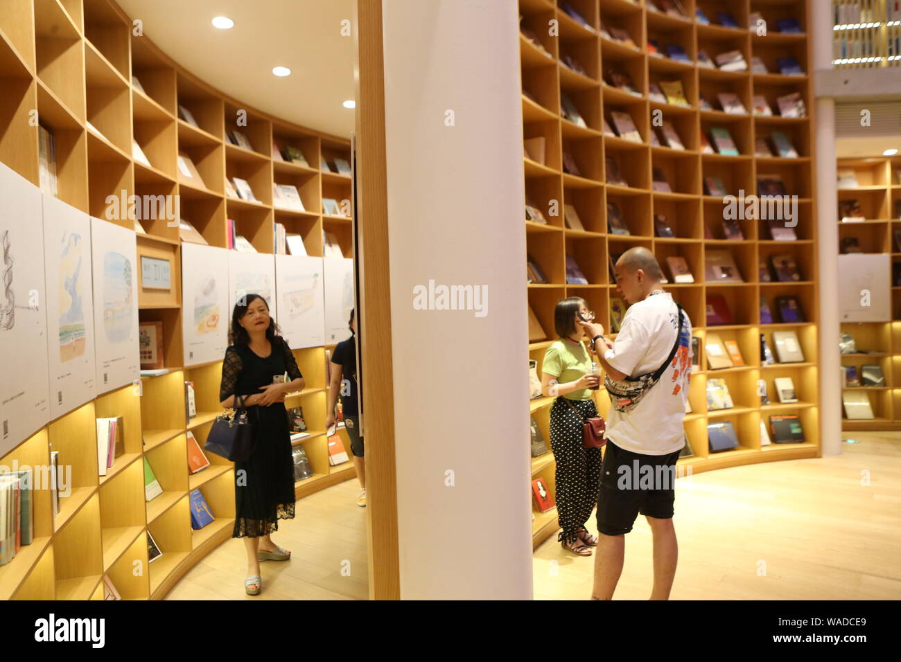 Readers stroll in the Xinhua Bookstore at Minhang district, Shanghai ...
