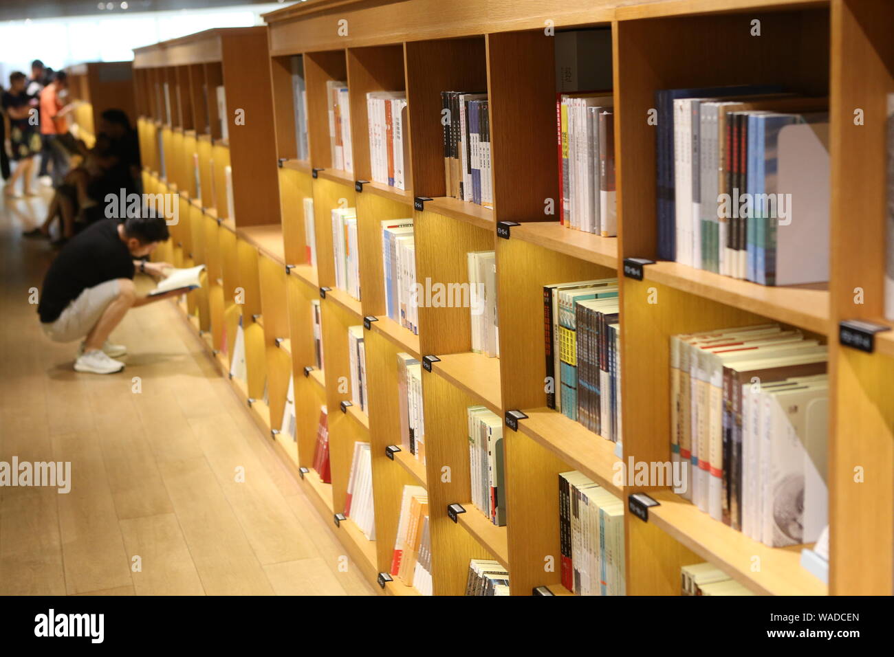 Readers stroll in the Xinhua Bookstore at Minhang district, Shanghai ...