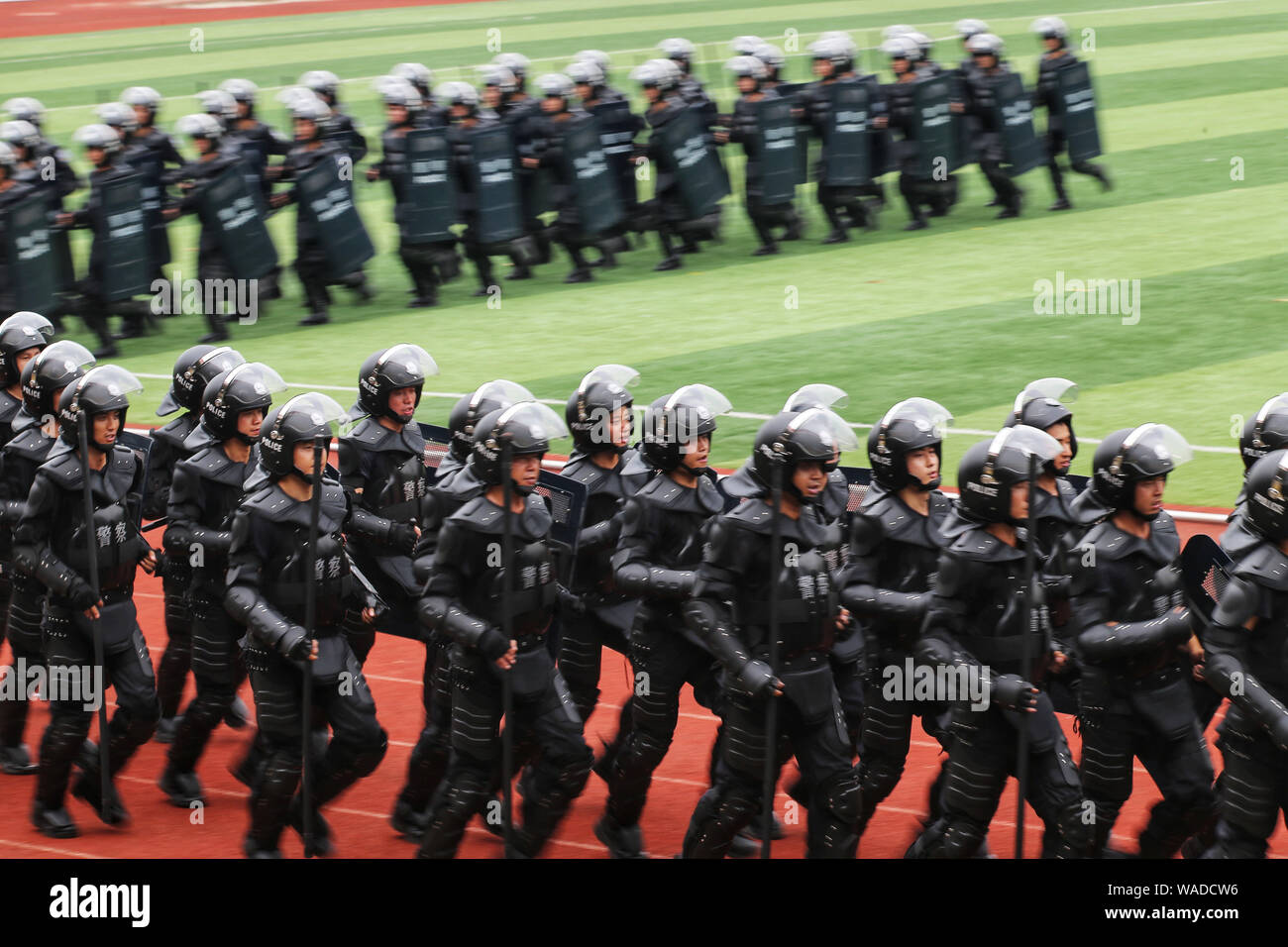 Chinese police officers, including SWAT police officers, take part in a combat drill in Chengdu city, southwest China's Sichuan province, 30 June 2019 Stock Photo