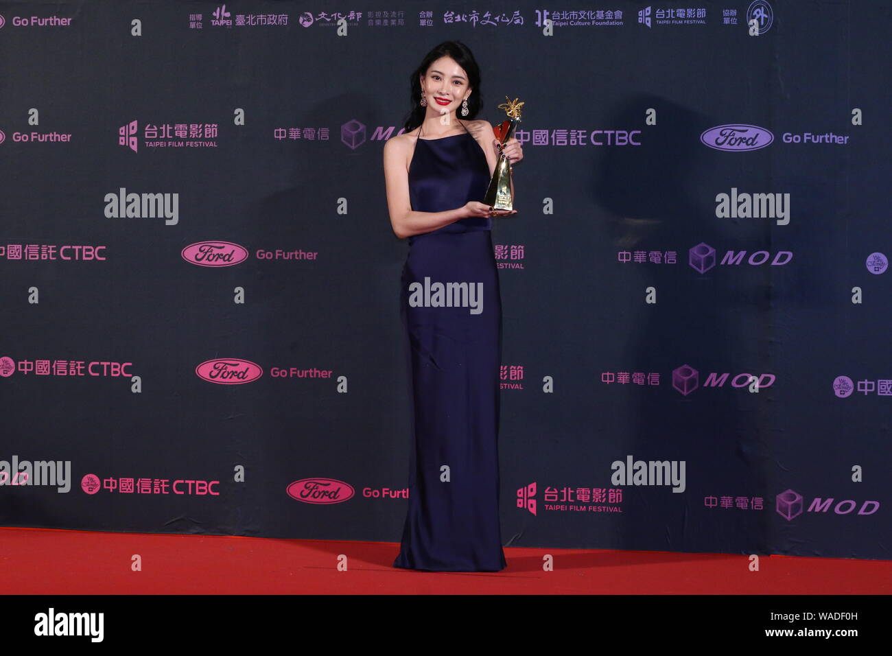 Taiwanese actress Li Yi-jie poses with her trophy after winning Best ...