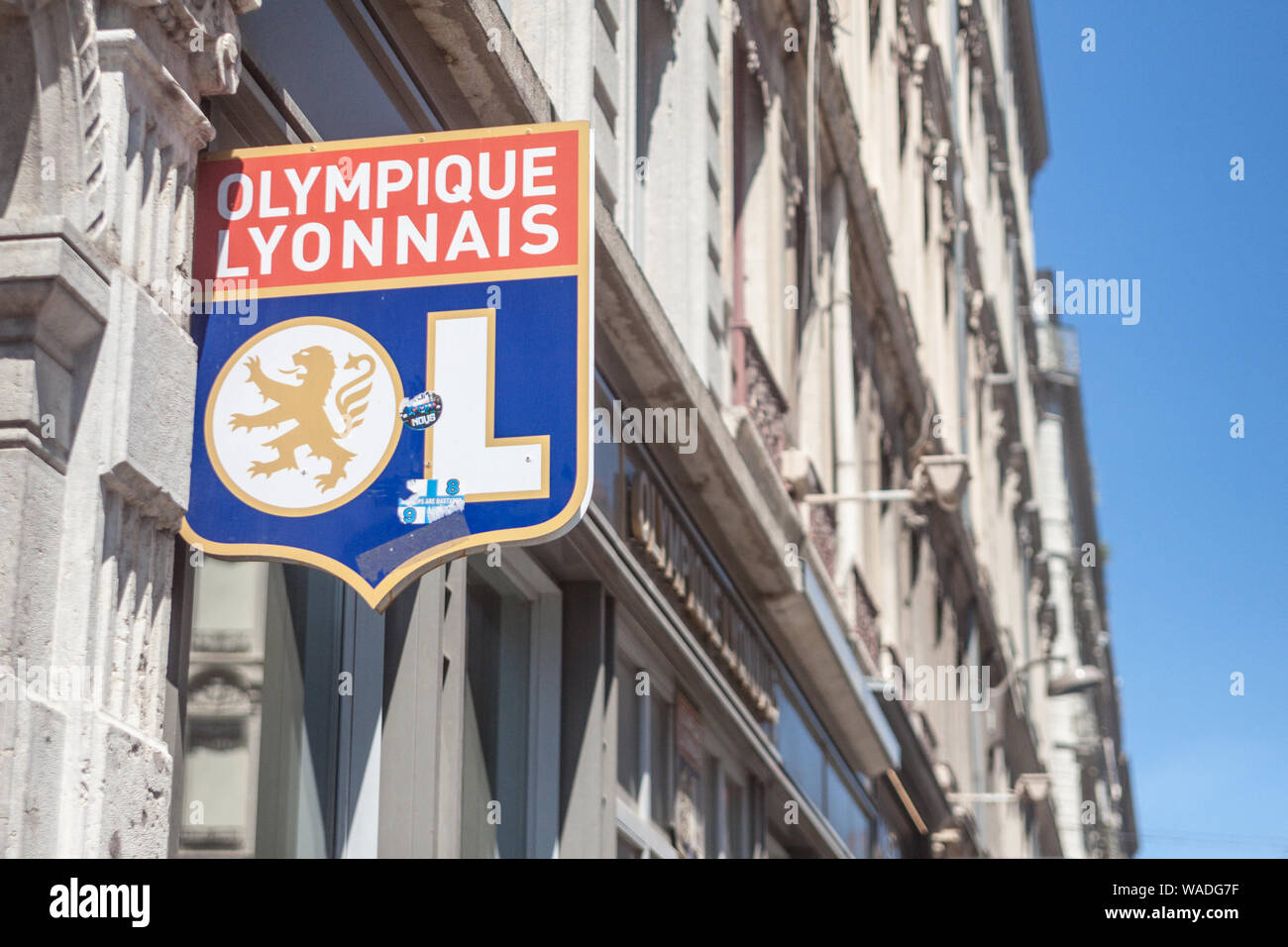 LYON, FRANCE - JULY 19, 2019: Olympique Lyonnais logo in front of their boutique in Lyon. Olympique Lyonnais, or OL, is a Football club, the biggest o Stock Photo