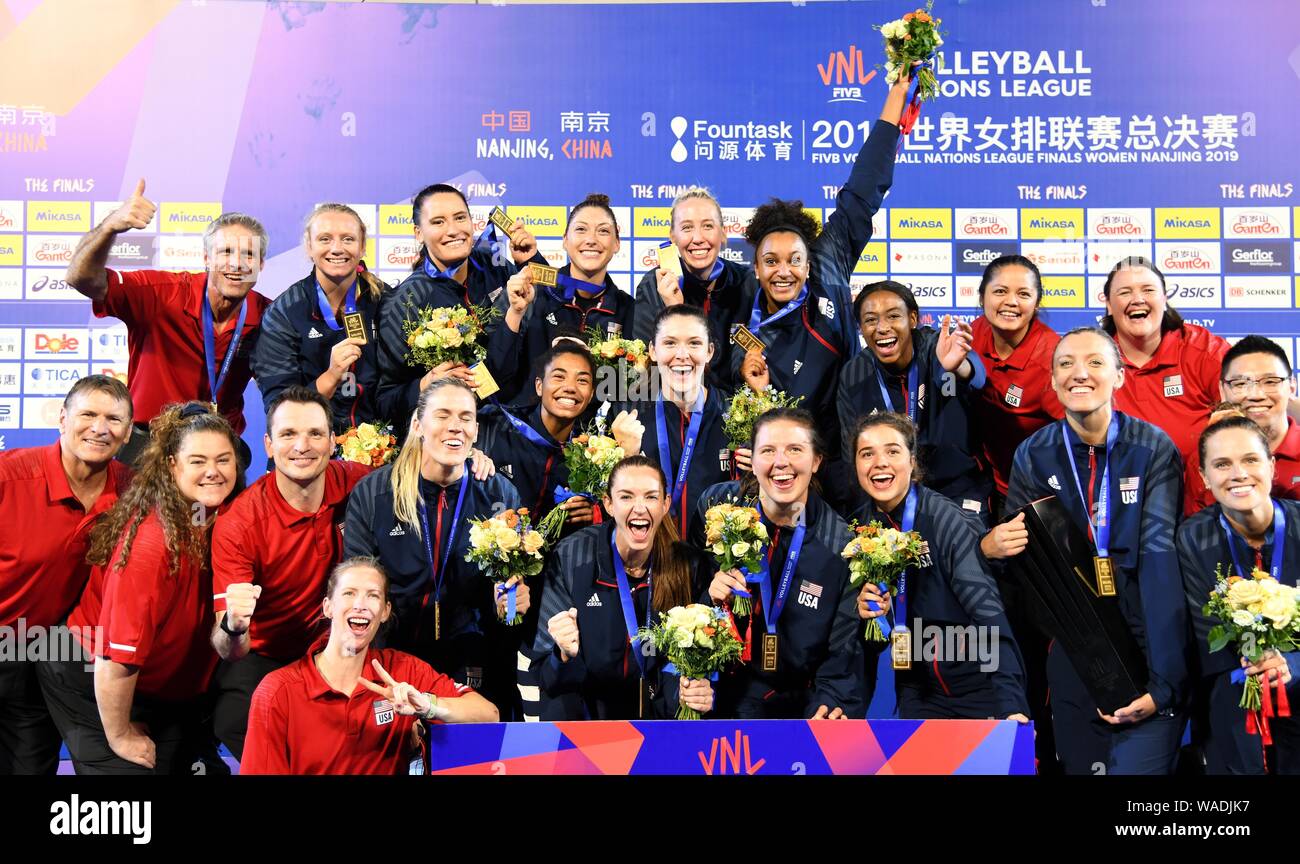 Players of United States womens national volleyball team pose with their trophy after winning the FIVB Volleyball Nations League Finals Women Nanjing Stock Photo