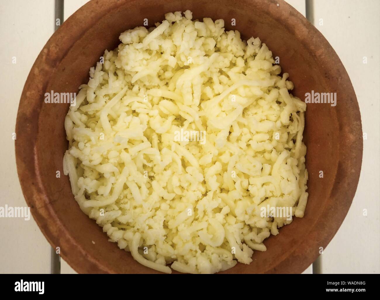 Bowl of Mixed Grated Cheeses Stock Photo