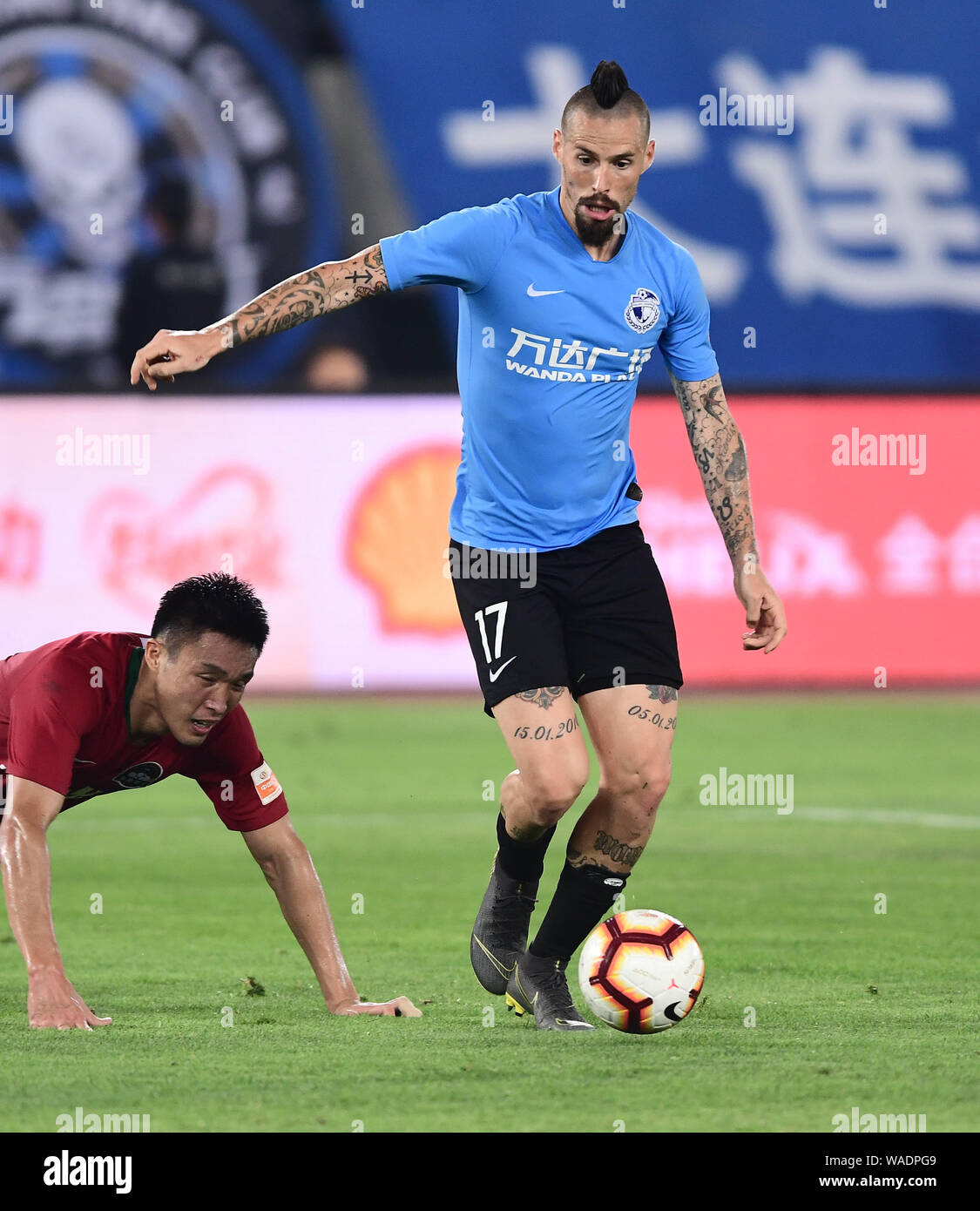 Slovak football player Marek Hamsik, right, of Dalian Yifang passes the  ball against a player of Henan Jianye in their 16th round match during the  201 Stock Photo - Alamy