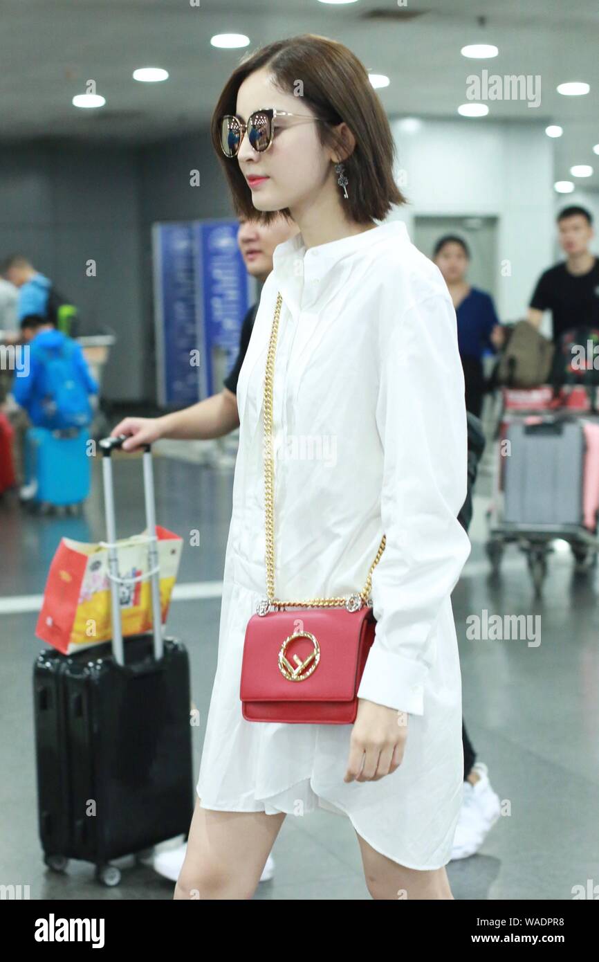 Chinese Uigur actress Gulnezer Bextiyar, also known as Gulnazar or Guli Nazha (Gulinazha), arrives at the Beijing Capital International Airport before Stock Photo