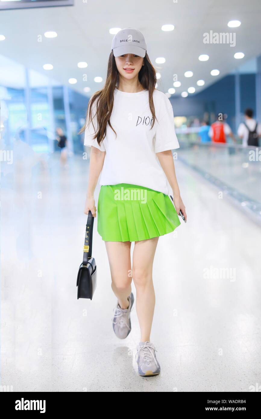 Hong Kong actress Angelababy arrives at an airport after landing in  Shanghai, China, 16 July 2019. T-shirt & Handbag: Dior Hat: Balenciaga  Stock Photo - Alamy