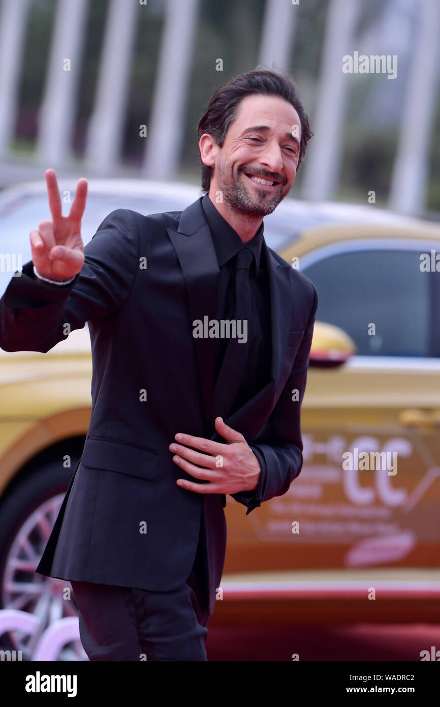 American actor and producer Adrien Brody poses on the red carpet during the closing ceremony for the Jackie Chan International Action Film Week in Dat Stock Photo