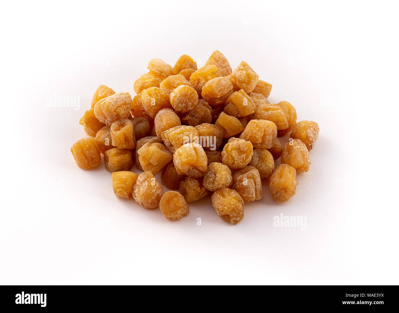 group of small dried scallops on white background Stock Photo Alamy