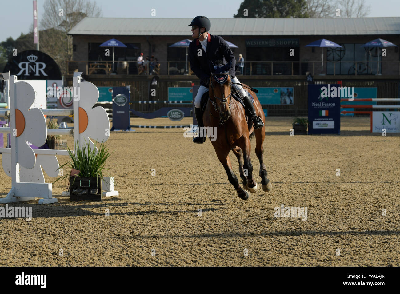 Durban, South Africa, show jumping competition, single adult man riding