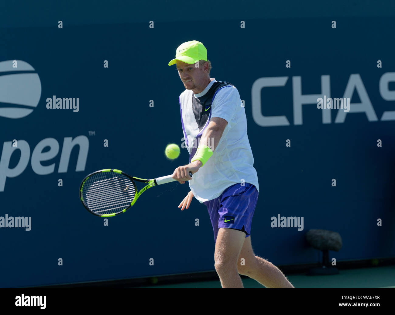 New York, NY - August 19, 2019: Alex Rybakov (USA) returns ball during qualifying round 1 of US Open Tennis Championship against Facundo Bagnis (Argentina) at Billie Jean King National Tennis Center Stock Photo