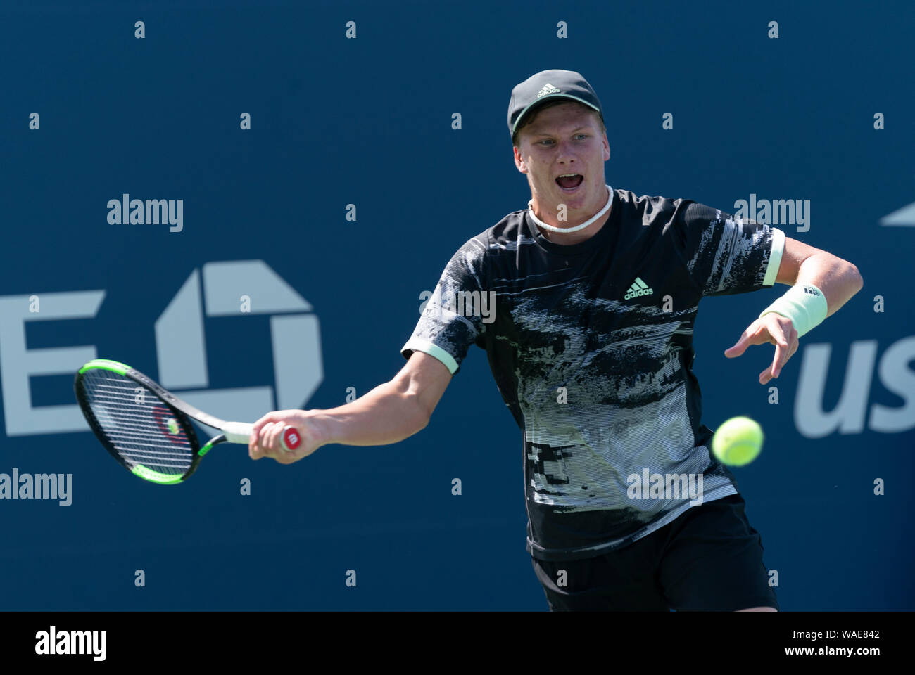 New York, NY - August 19, 2019: Jenson Brooksby (USA) returns ball during  qualifying round 1 of US Open Tennis Championship against Kaichi Uchida  (Japan) at Billie Jean King National Tennis Center Stock Photo - Alamy