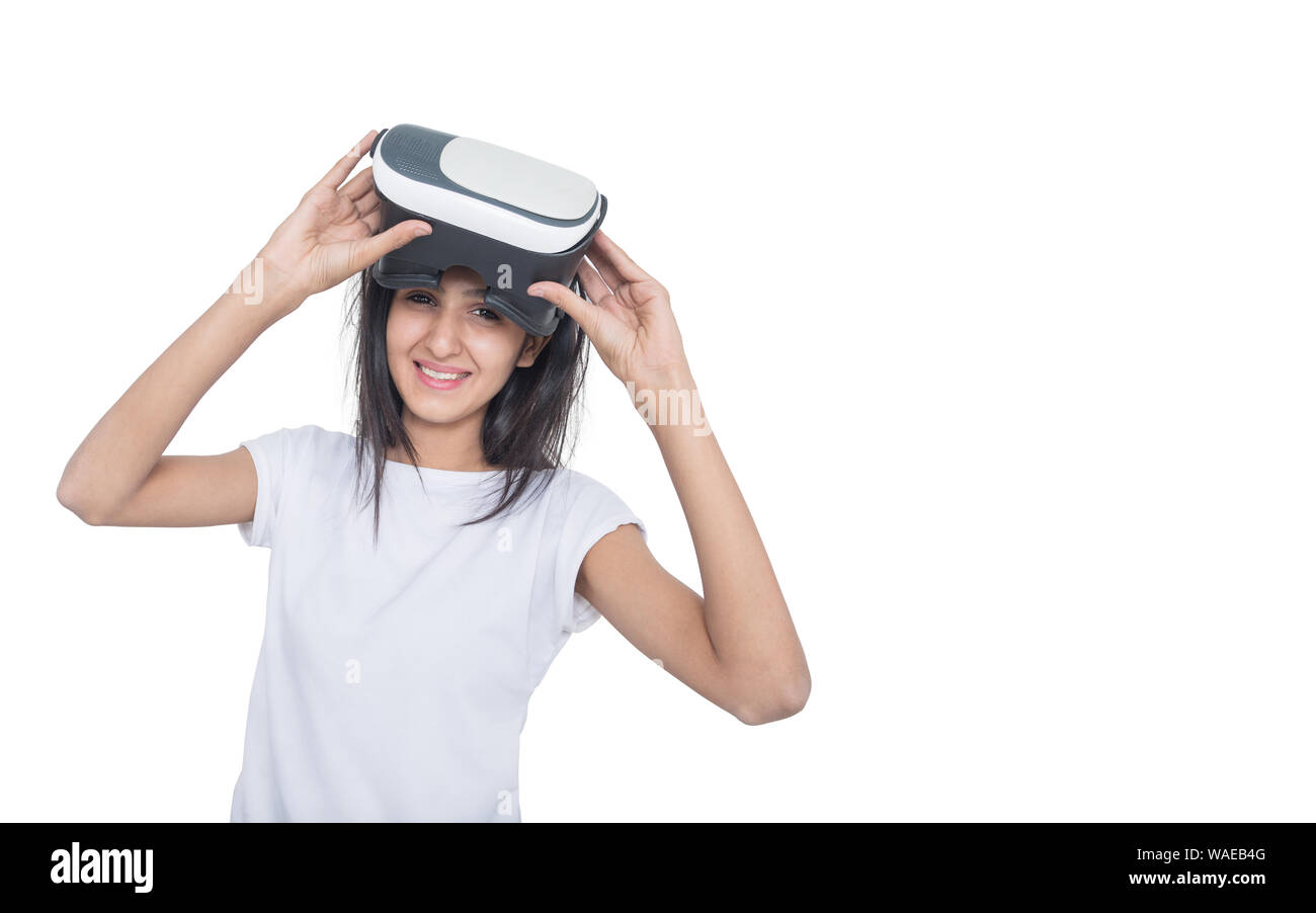 Women wearing VR-headset glasses of virtual reality on isolated white background ,future technology concept. Stock Photo
