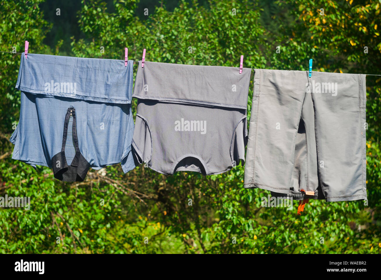 clothes on the wire for dry outdoors Stock Photo