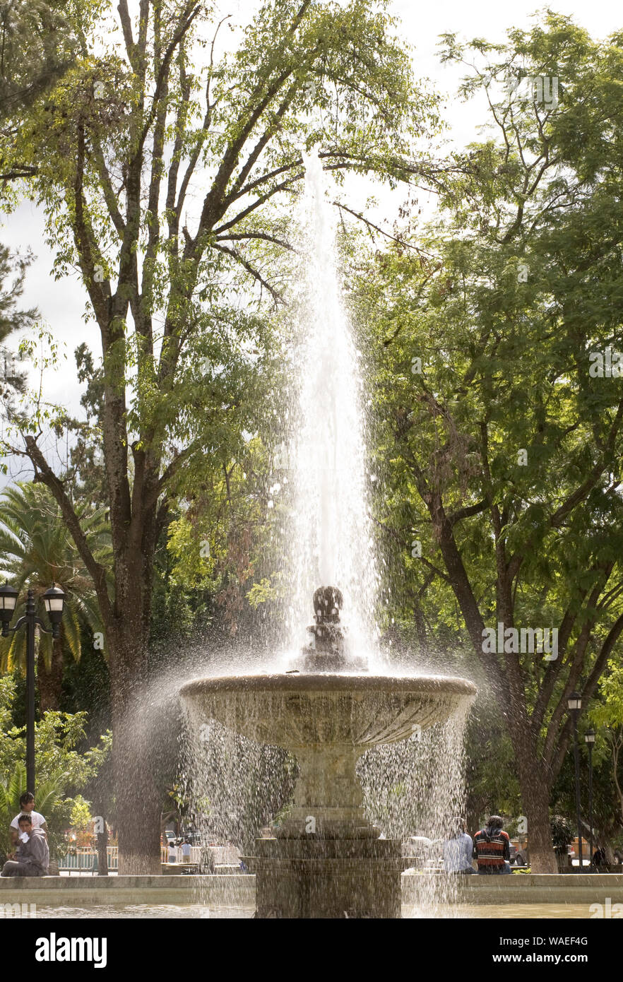 A beautiful classical fountain in city plaza, Oaxaca City, Oaxaca, Mexico public parks and formal gardens Stock Photo