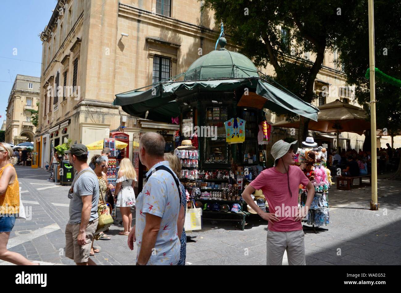 souvenir shops and cafes and tourists on republic street valletta malta