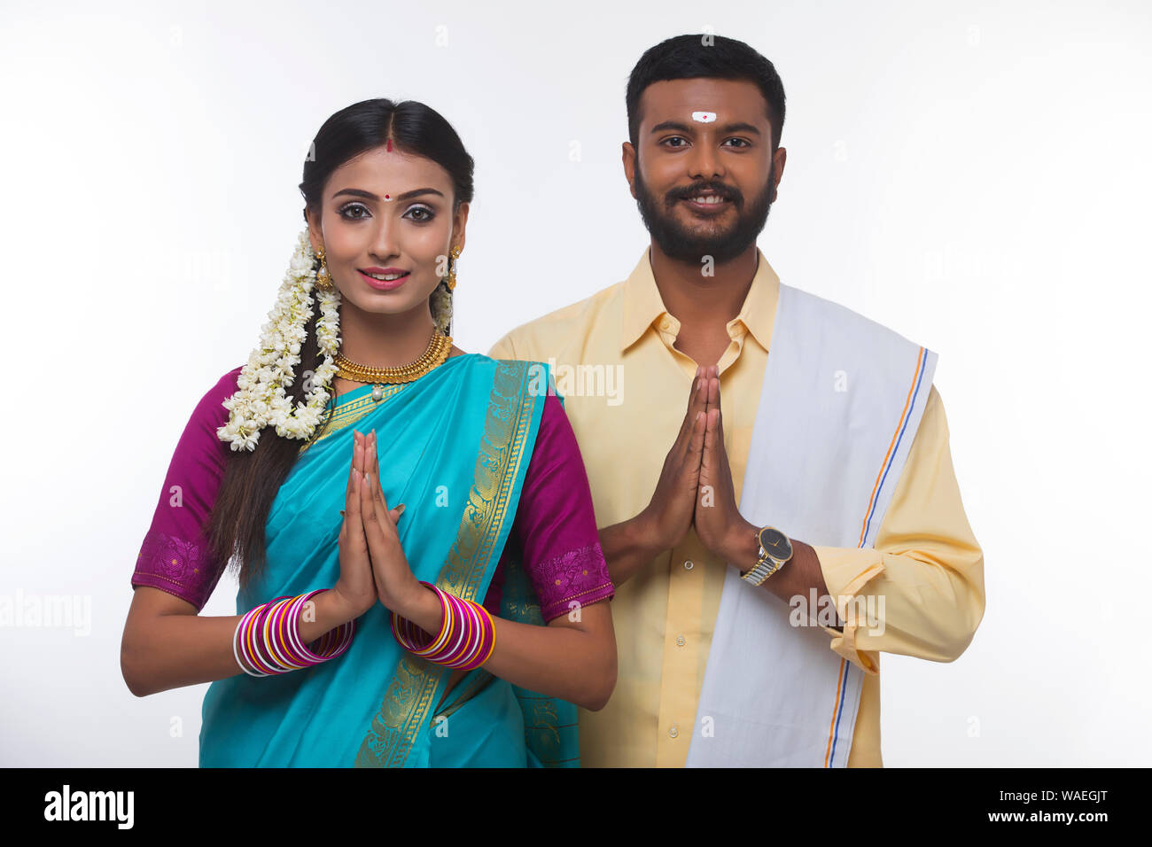 south indian couple greeting and smiling at the camera Stock Photo - Alamy
