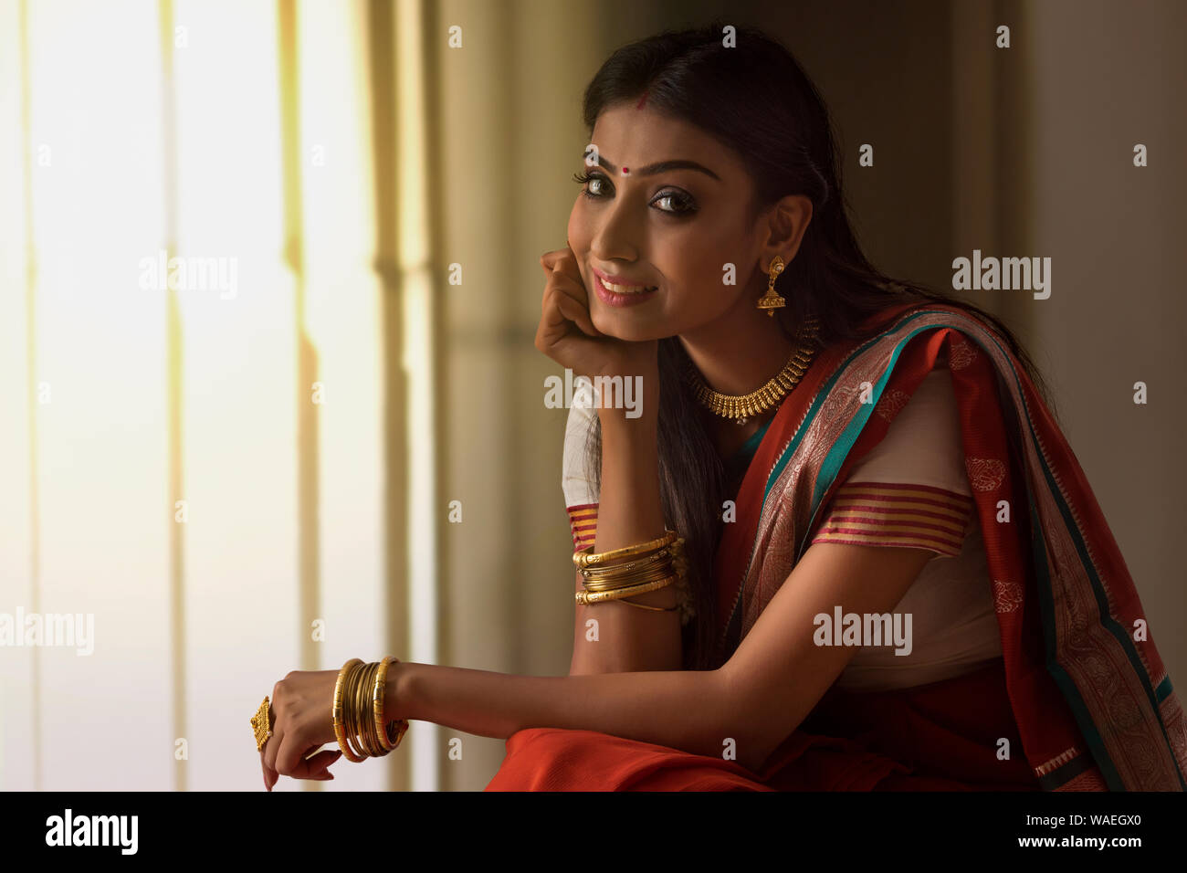 portrait of a south indian woman looking at the camera Stock Photo - Alamy