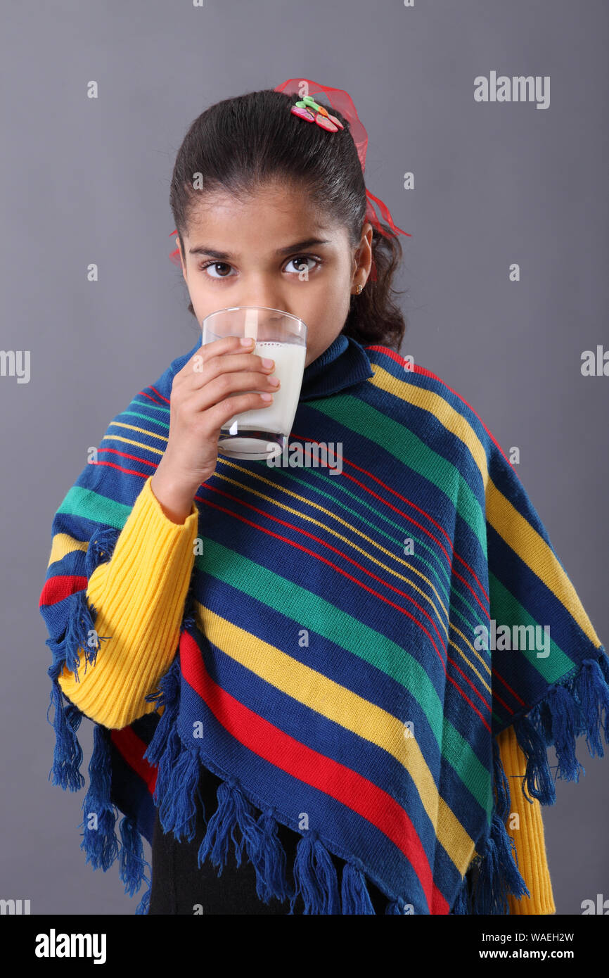 Schoolgirl looking tired while studying Stock Photo