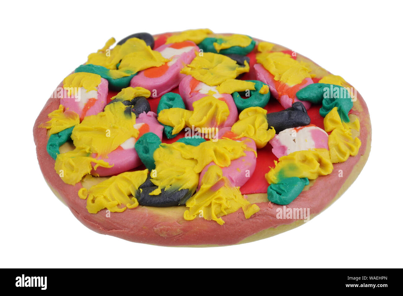 In the future we will eat this concept. Mini pizza made of clay plasticine. Isolated on white studio macro Stock Photo