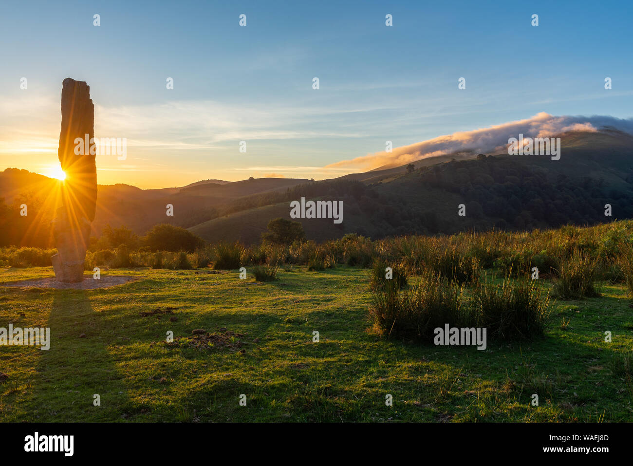 Menhir of Arlobi at sunset, Gorbea Natural Park, Alava, Spain Stock Photo