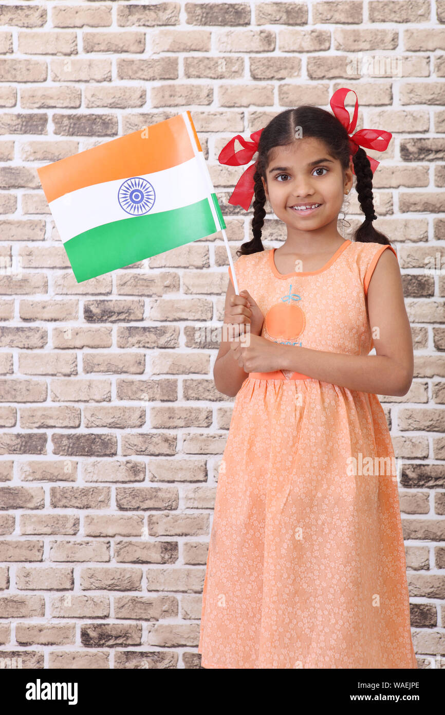 Indian girl holding an indian flag hires stock photography and images