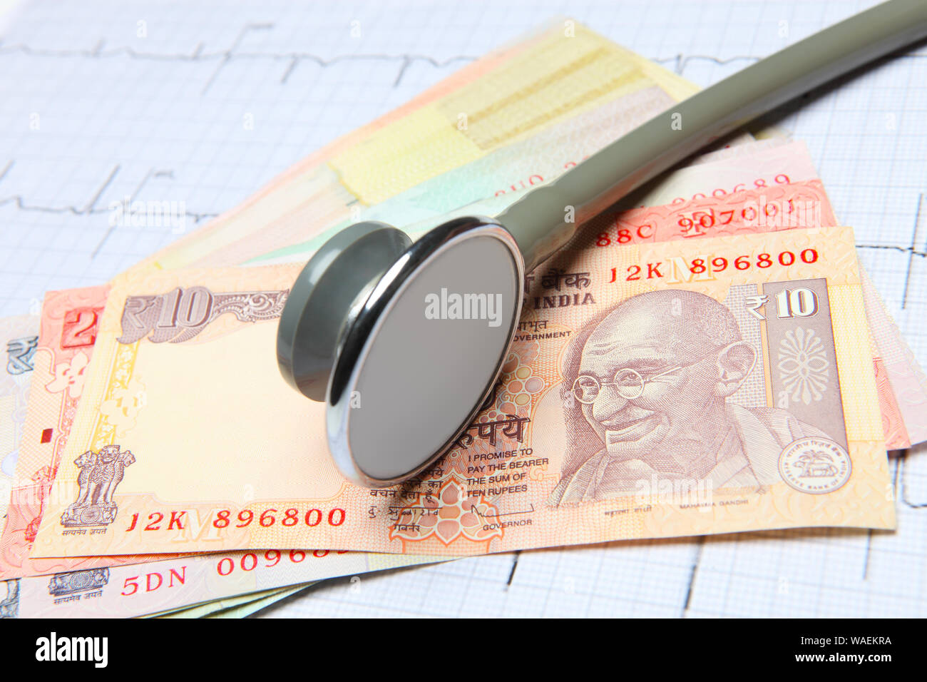 Stethoscope with Indian currency representing health insurance Stock
