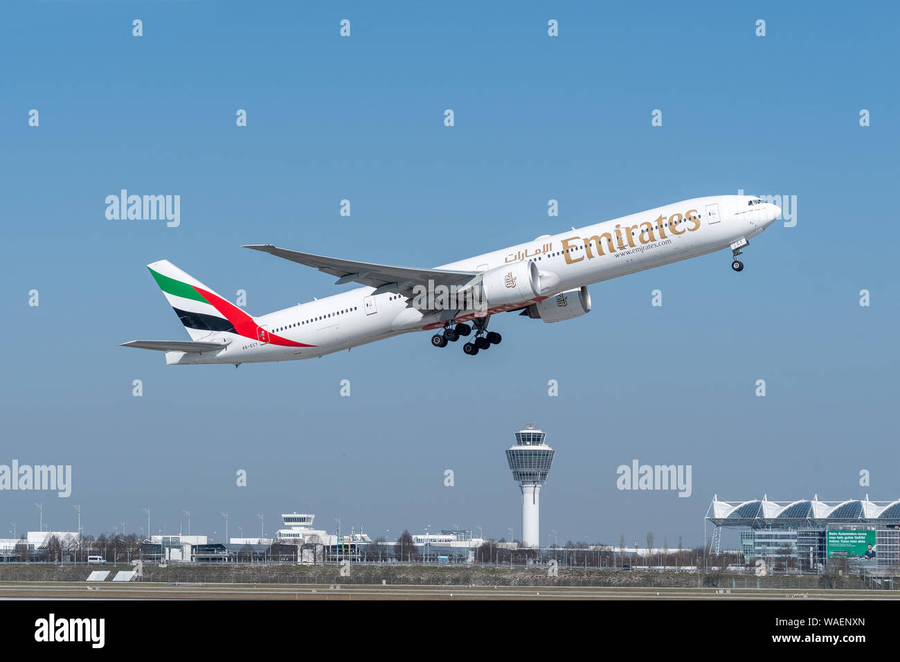 Munich, Germany - March 31. 2019 : Emirates Boeing 777-31H with the aircraft registration number A6-ECY during take off on the southern runway 08R of Stock Photo