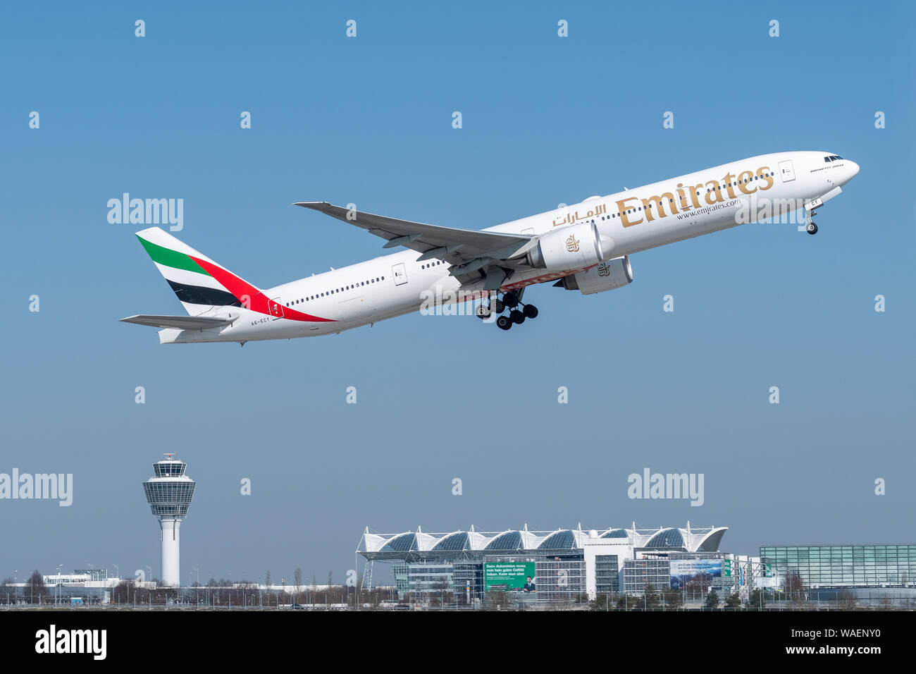 Munich, Germany - March 31. 2019 : Emirates Boeing 777-31H with the aircraft registration number A6-ECY during take off on the southern runway 08R of Stock Photo
