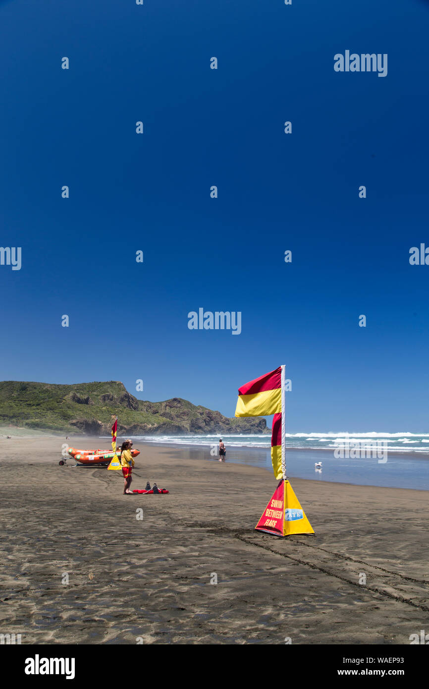 Scorching hot day at Bethells Beach, west Auckland. Black sand gets hot