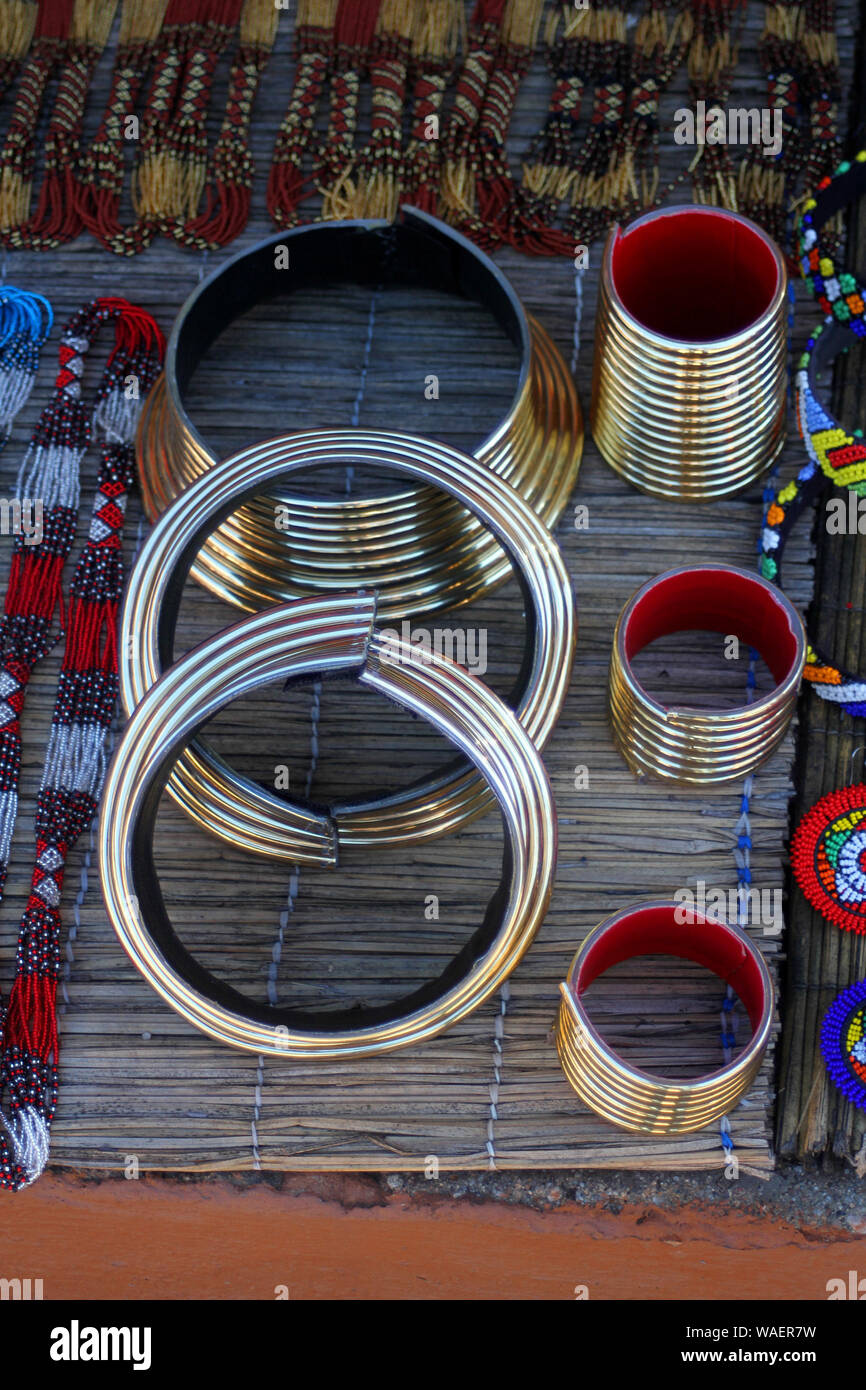 Beaded jewellery and traditional Ndebele Neck Ring/choker sold as souvenirs on display at Lesedi Cultural Village, Cradle of Humankind, South Africa Stock Photo