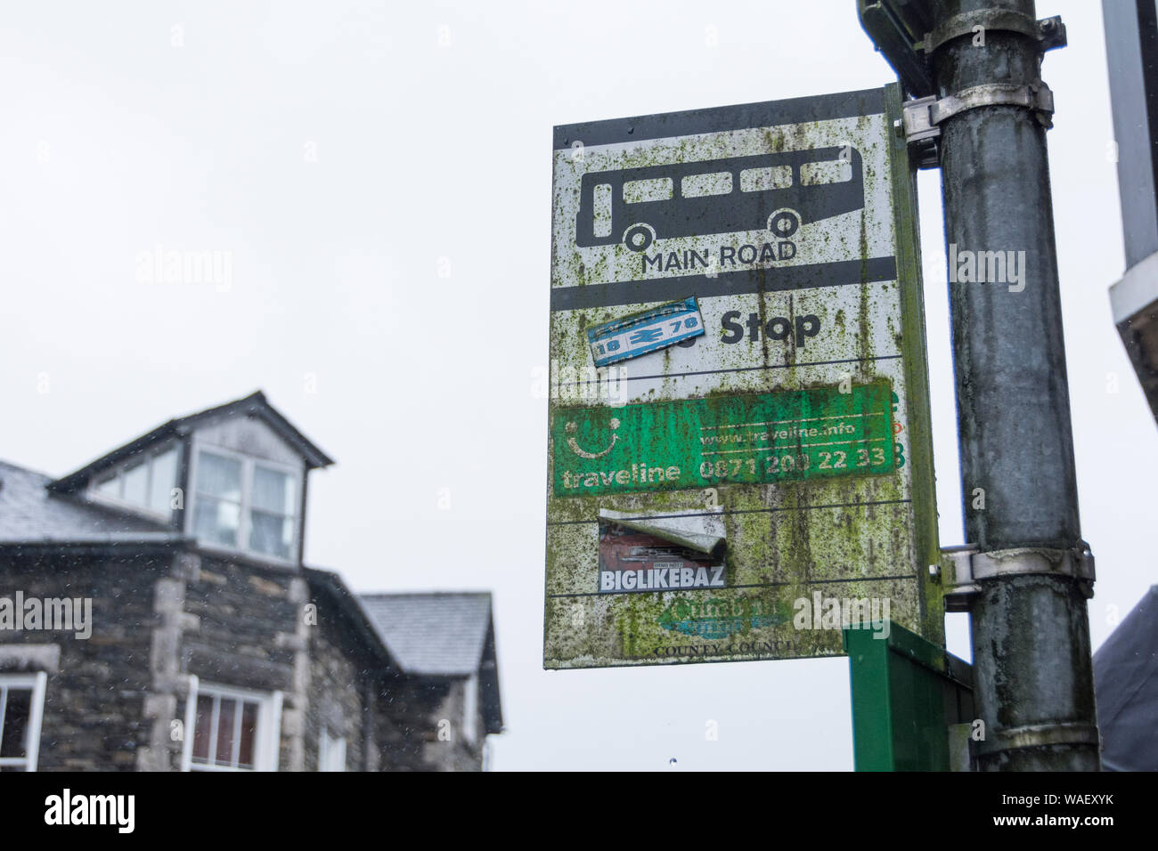 The decline in rural bus services -a  worn and weathered rural bust stop sign Stock Photo