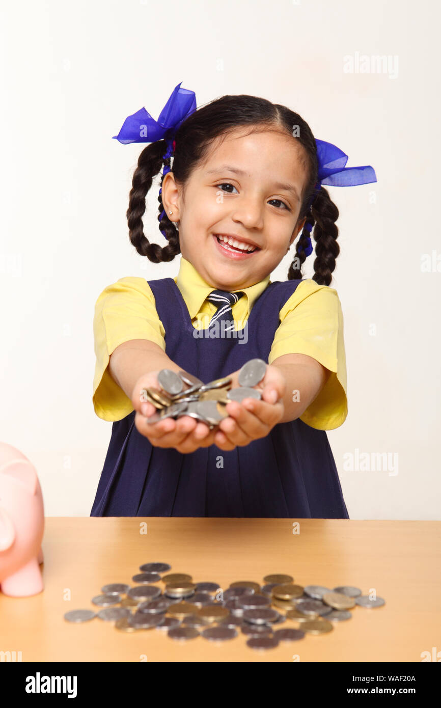 Indian schoolgirl showing her pocket money Stock Photo Alamy