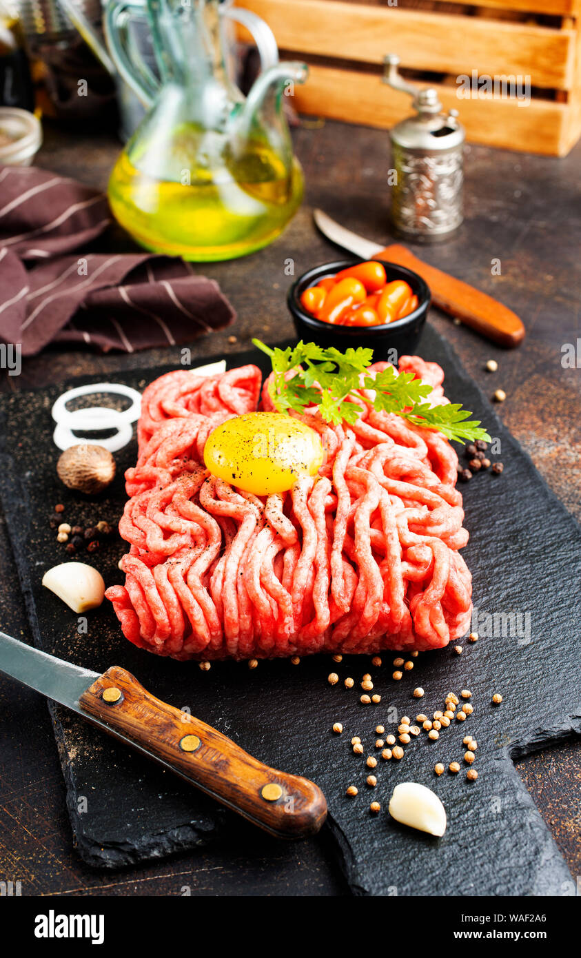 Raw minced meat with egg, herbs and spices Stock Photo Alamy