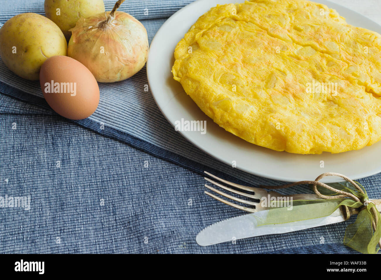 spanish omelette called tortilla de patatas with vintage cutlery Stock Photo