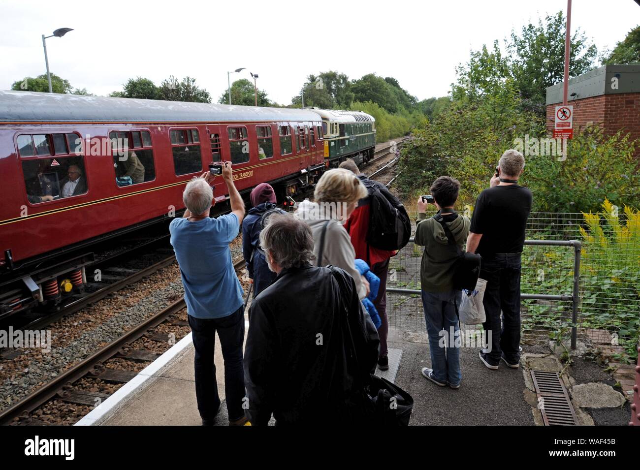 Railway enthusiasts photographing a railway excursion train at Warminster station 17th August 2019 Stock Photo